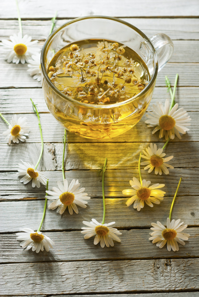 Herbal,Tea,With,Chamomile,Flowers,,Old,Wood,Table,Background